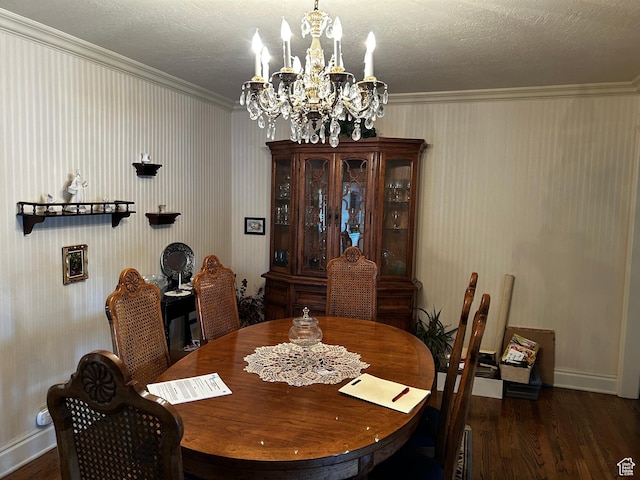 dining room featuring a chandelier, a textured ceiling, and wood finished floors