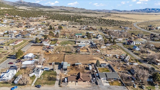 birds eye view of property featuring a mountain view