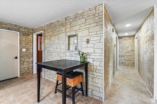dining area with a textured ceiling