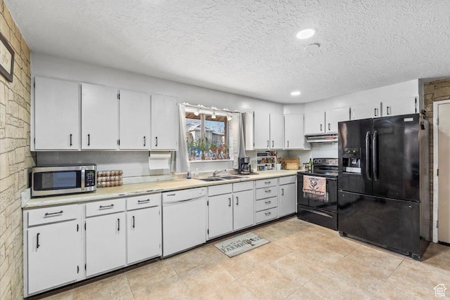 kitchen with black appliances, under cabinet range hood, white cabinets, and light countertops