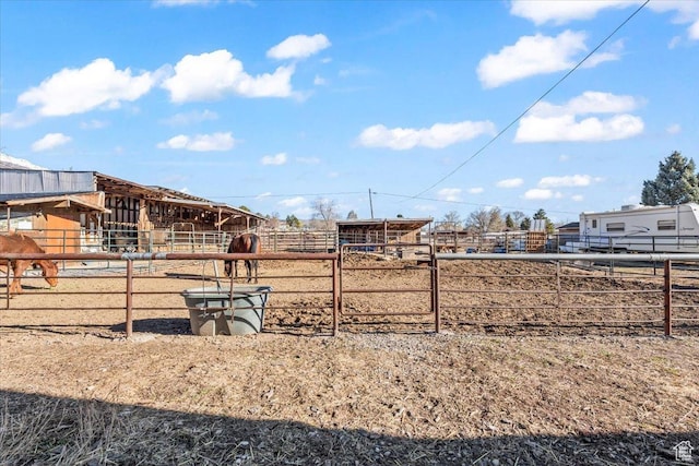 view of yard featuring an outbuilding and an exterior structure