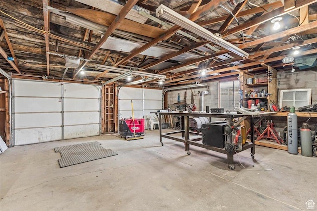 garage with a workshop area