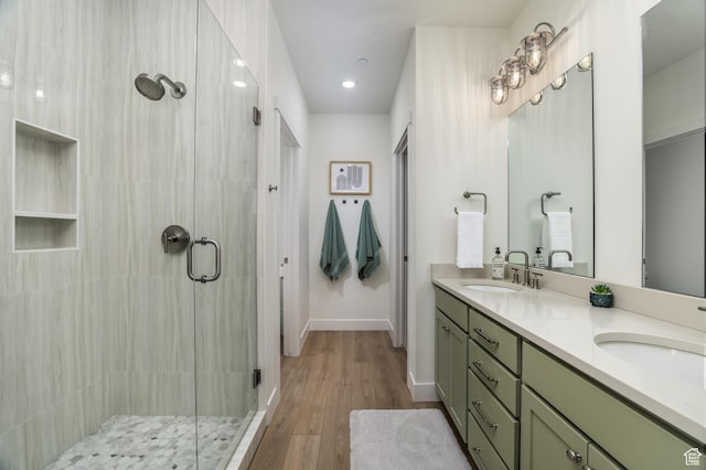757 W Periwinkle Ln Unit 210, St George, UT 84790 - bathroom featuring a stall shower, double vanity, wood finished floors, recessed lighting, and baseboards