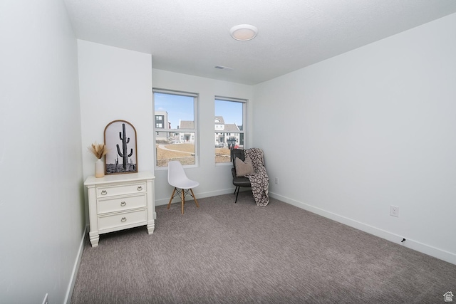 6219 W S Jordan Pkwy Unit 221, South Jordan, UT 84009 - sitting room featuring visible vents, a textured ceiling, baseboards, and carpet floors