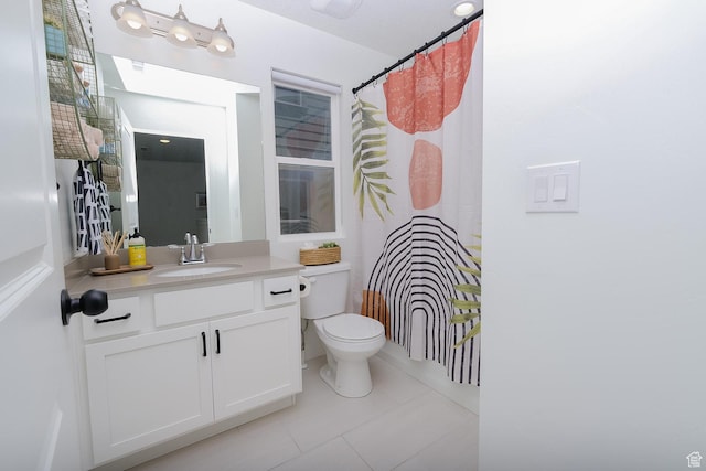 6219 W S Jordan Pkwy Unit 221, South Jordan, UT 84009 - full bath with tile patterned floors, toilet, vanity, and a shower with curtain