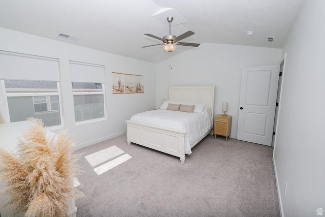 6219 W S Jordan Pkwy Unit 221, South Jordan, UT 84009 - bedroom featuring visible vents, lofted ceiling, light carpet, and a ceiling fan