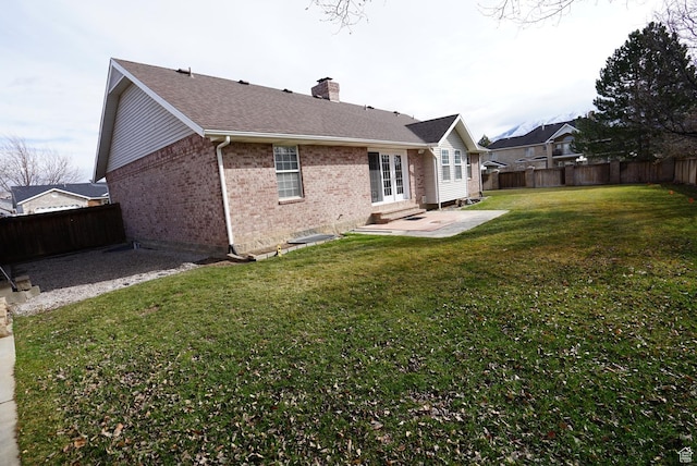 1046 E 1100 S, Spanish Fork, UT 84660 - back of house with brick siding, a patio area, a chimney, roof with shingles, and entry steps
