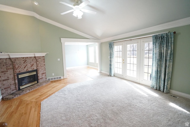 1046 E 1100 S, Spanish Fork, UT 84660 - unfurnished living room featuring ornamental molding, a ceiling fan, baseboards, lofted ceiling, and a brick fireplace