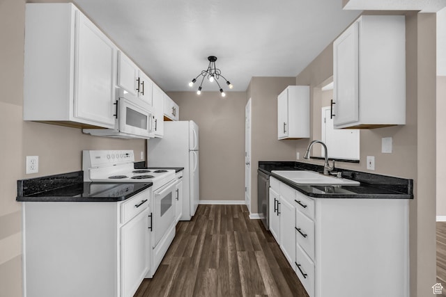 3860 S Mccall St Unit 2D, South Salt Lake, UT 84115 - kitchen with white appliances, dark wood-type flooring, dark countertops, and white cabinets