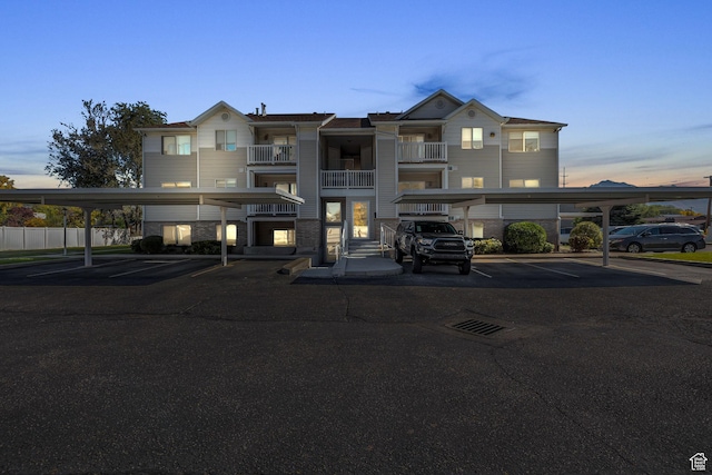 3860 S Mccall St Unit 2D, South Salt Lake, UT 84115 - property at dusk with covered parking