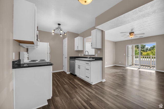 3860 S Mccall St Unit 2D, South Salt Lake, UT 84115 - kitchen with dark countertops, a ceiling fan, dark wood-style floors, and a chandelier