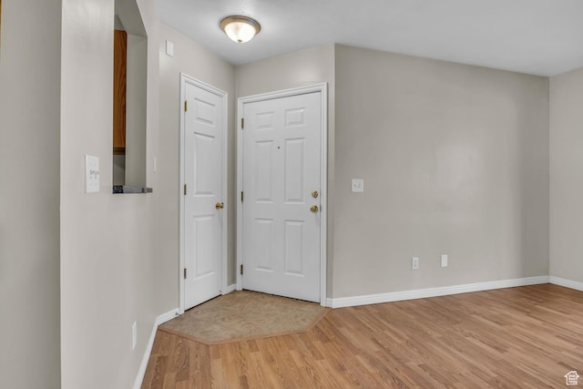 3860 S Mccall St Unit 2D, South Salt Lake, UT 84115 - entrance foyer with baseboards and light wood-style flooring