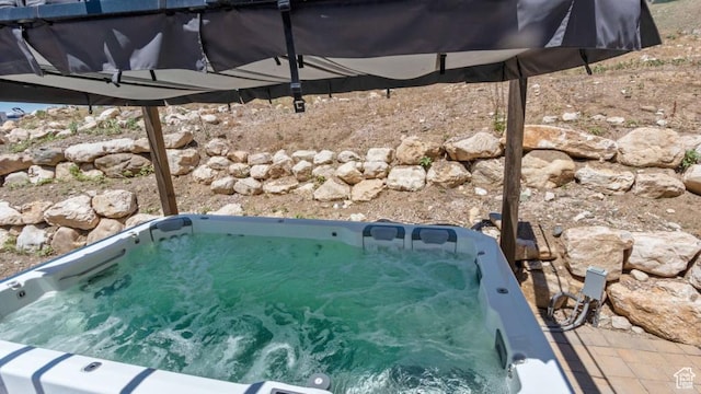 exterior space featuring a hot tub