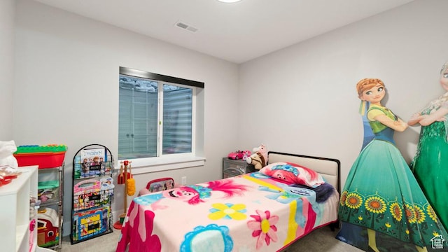 bedroom featuring carpet floors and visible vents