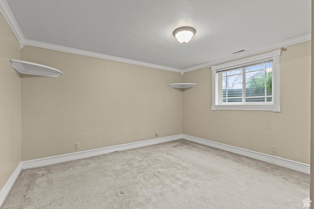 spare room with crown molding and carpet flooring