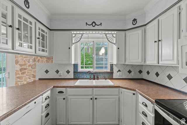 kitchen with white dishwasher, a sink, and white cabinetry