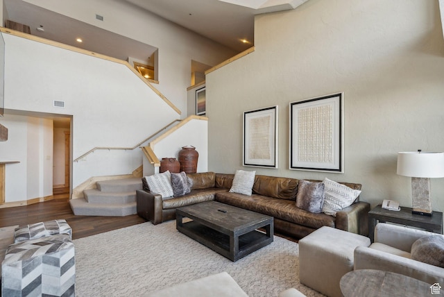 3855 Grand Summit Dr Unit 701Q3, Park City, UT 84098 - living room featuring stairs, visible vents, a high ceiling, and wood finished floors