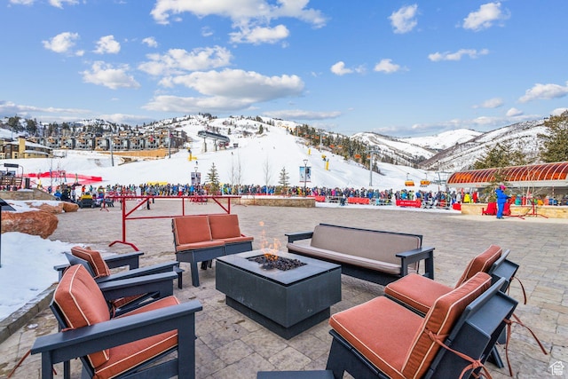 3855 Grand Summit Dr Unit 701Q3, Park City, UT 84098 - snow covered patio with a mountain view and an outdoor living space with a fire pit