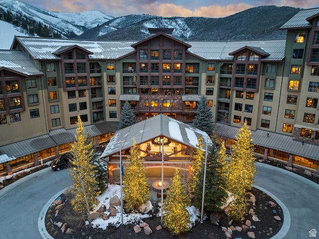 snow covered building with a mountain view