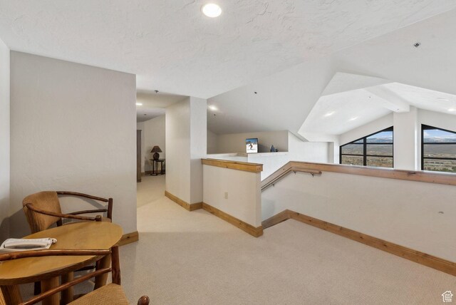 3855 Grand Summit Dr Unit 701Q3, Park City, UT 84098 - bonus room with light colored carpet, vaulted ceiling, baseboards, and a textured ceiling