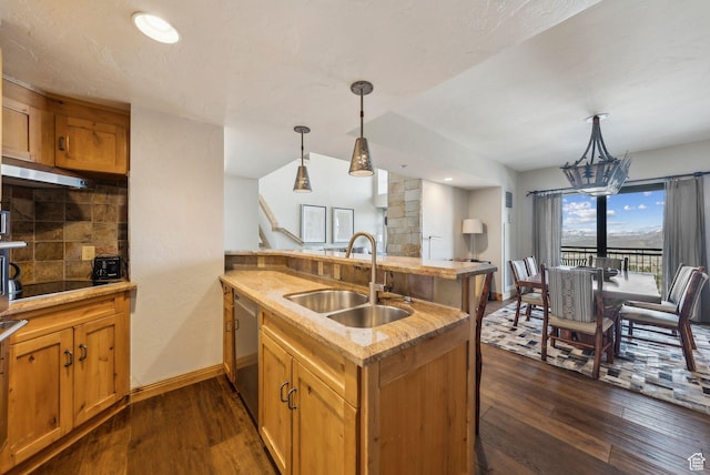 3855 Grand Summit Dr Unit 701Q3, Park City, UT 84098 - kitchen with light countertops, dishwasher, under cabinet range hood, a sink, and dark wood-style floors