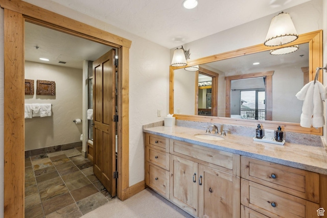 3855 Grand Summit Dr Unit 701Q3, Park City, UT 84098 - bathroom with vanity, recessed lighting, toilet, baseboards, and stone finish flooring
