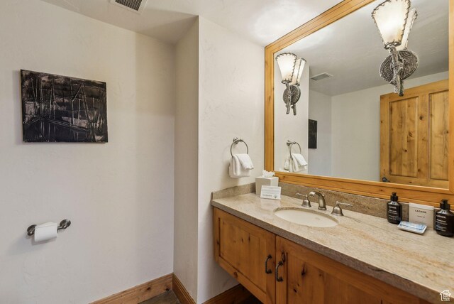 3855 Grand Summit Dr Unit 701Q3, Park City, UT 84098 - bathroom with baseboards, visible vents, and vanity
