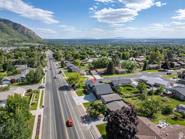 birds eye view of property with a mountain view and a residential view