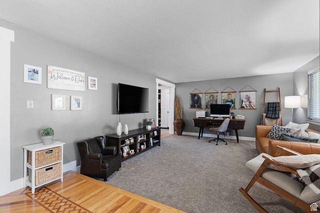 interior space with baseboards and wood finished floors