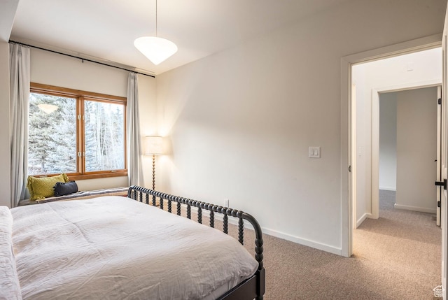 carpeted bedroom with baseboards