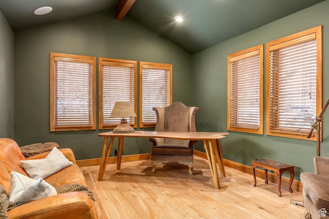 home office featuring baseboards, vaulted ceiling with beams, and wood finished floors