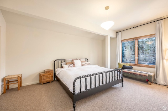 carpeted bedroom with baseboards