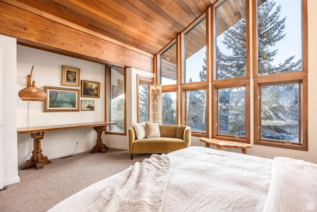 bedroom with baseboards, carpet floors, and wooden ceiling