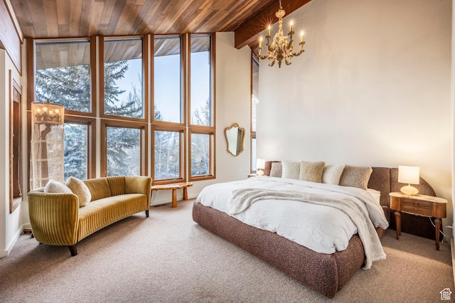 carpeted bedroom with wooden ceiling, high vaulted ceiling, and a notable chandelier