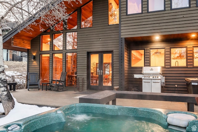 view of swimming pool featuring french doors, area for grilling, and an outdoor hot tub