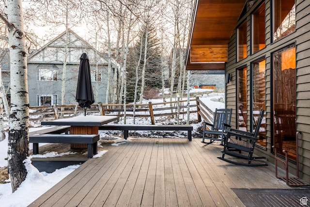 view of snow covered deck