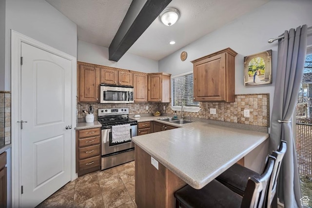 1951 N Hollow Ct, Lehi, UT 84043 - kitchen with backsplash, a sink, appliances with stainless steel finishes, and a peninsula