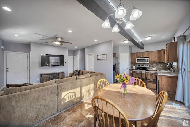 1951 N Hollow Ct, Lehi, UT 84043 - dining area with ceiling fan with notable chandelier, a fireplace, and recessed lighting