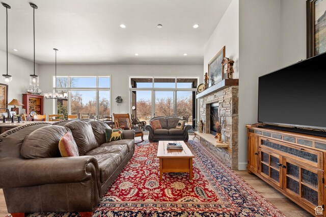 481 Thorn View Ct Unit 6, Kamas, UT 84036 - living room with a fireplace, light wood-style floors, recessed lighting, and an inviting chandelier
