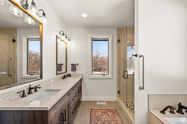 481 Thorn View Ct Unit 6, Kamas, UT 84036 - full bath with a stall shower, baseboards, visible vents, and a sink