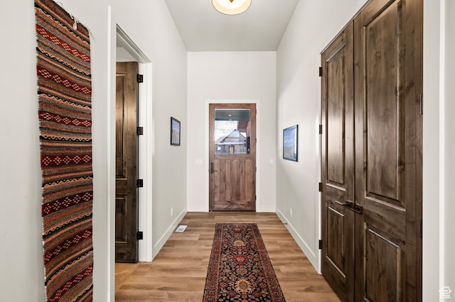 481 Thorn View Ct Unit 6, Kamas, UT 84036 - doorway to outside with light wood-style flooring and baseboards