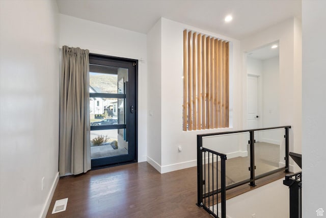 foyer with recessed lighting, baseboards, visible vents, and wood finished floors