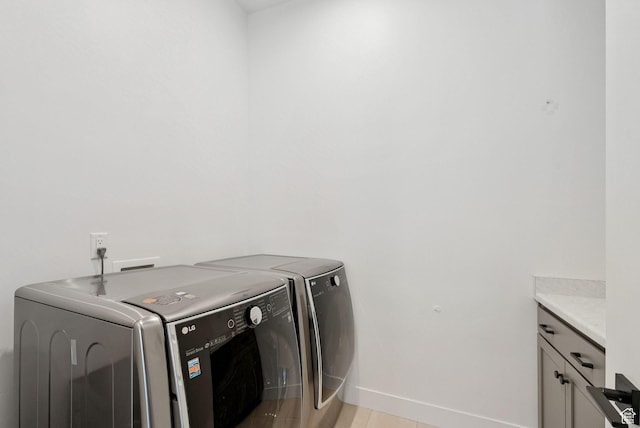 5641 N Canyon Rim Rd, Lehi, UT 84043 - laundry area with washing machine and dryer, cabinet space, and baseboards