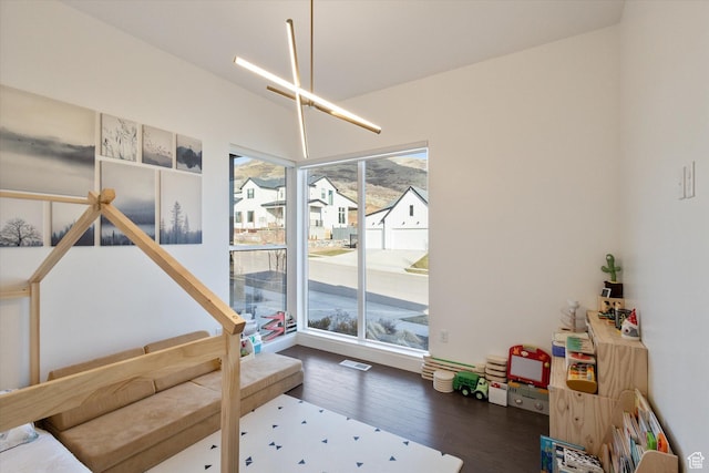 dining room with a residential view and wood finished floors