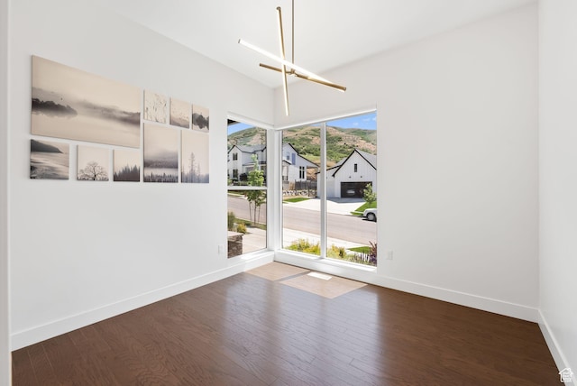 5641 N Canyon Rim Rd, Lehi, UT 84043 - unfurnished room featuring wood finished floors, baseboards, and a residential view