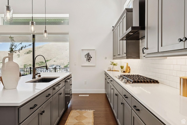 5641 N Canyon Rim Rd, Lehi, UT 84043 - kitchen with wall chimney exhaust hood, a sink, gray cabinets, and baseboards