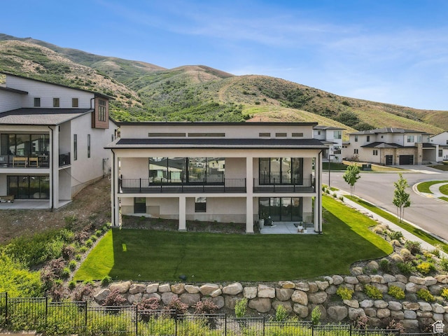 5641 N Canyon Rim Rd, Lehi, UT 84043 - rear view of property with a mountain view, a balcony, and stucco siding