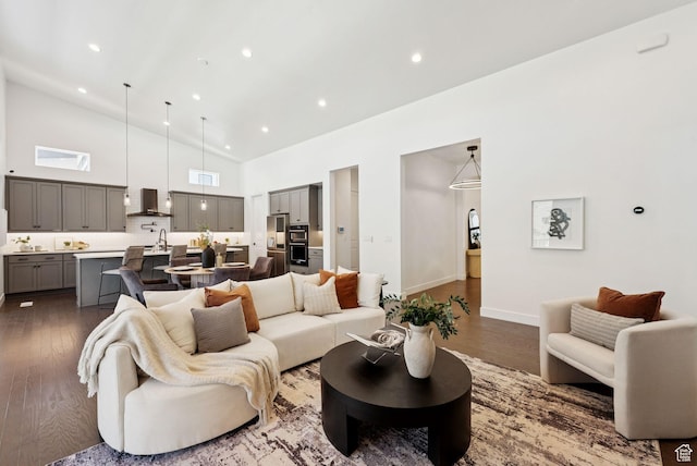 5641 N Canyon Rim Rd, Lehi, UT 84043 - living area featuring dark wood finished floors, high vaulted ceiling, recessed lighting, and baseboards