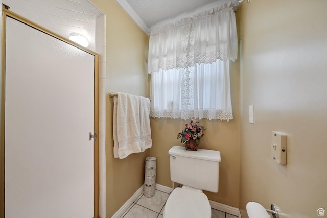 1376 Granada Dr, Bountiful, UT 84010 - bathroom featuring a stall shower, crown molding, toilet, tile patterned flooring, and baseboards
