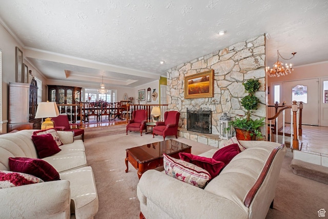 1376 Granada Dr, Bountiful, UT 84010 - carpeted living area featuring a fireplace, ornamental molding, a chandelier, and a textured ceiling